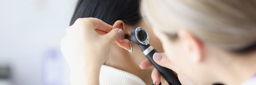 close up otolaryngologist ear exam of patient